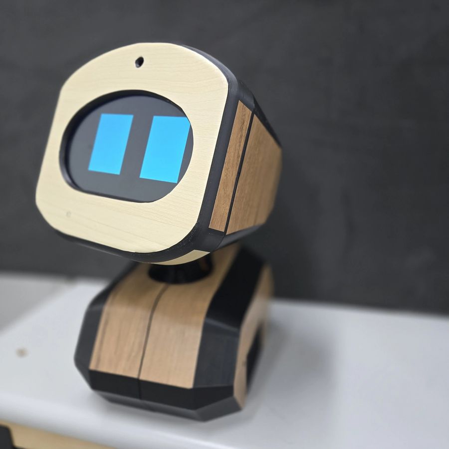 MyCo, the Stones Corner AI social robot, with a wooden body and a screen face